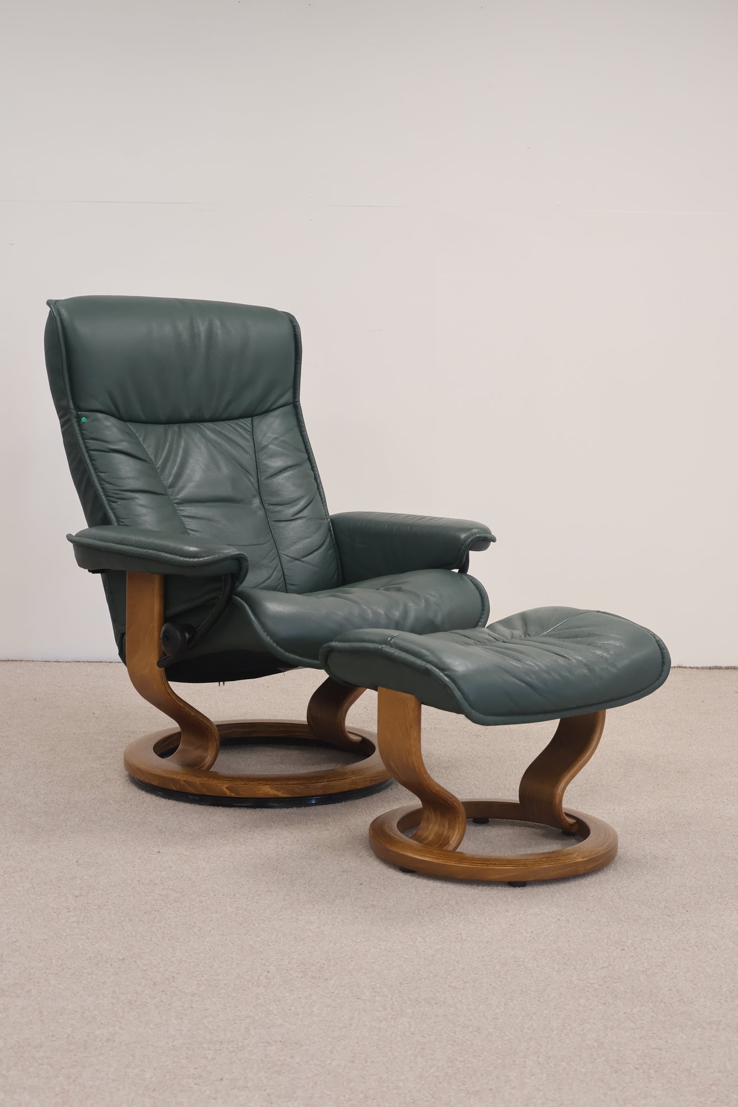 Dark Green Recliner and Footstool by Ekornes