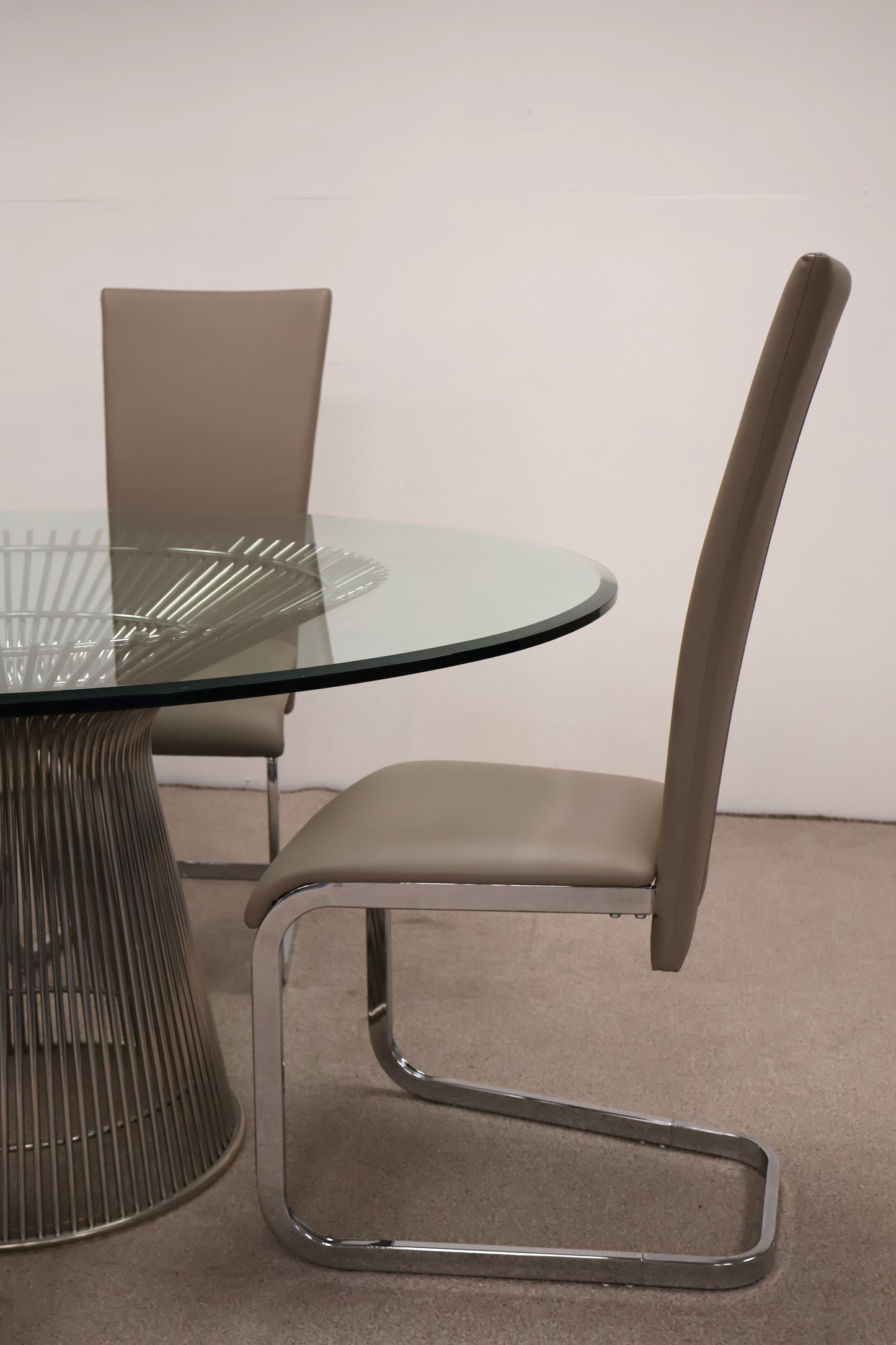 Circular Glass Table with Ornate Chrome base and Chairs