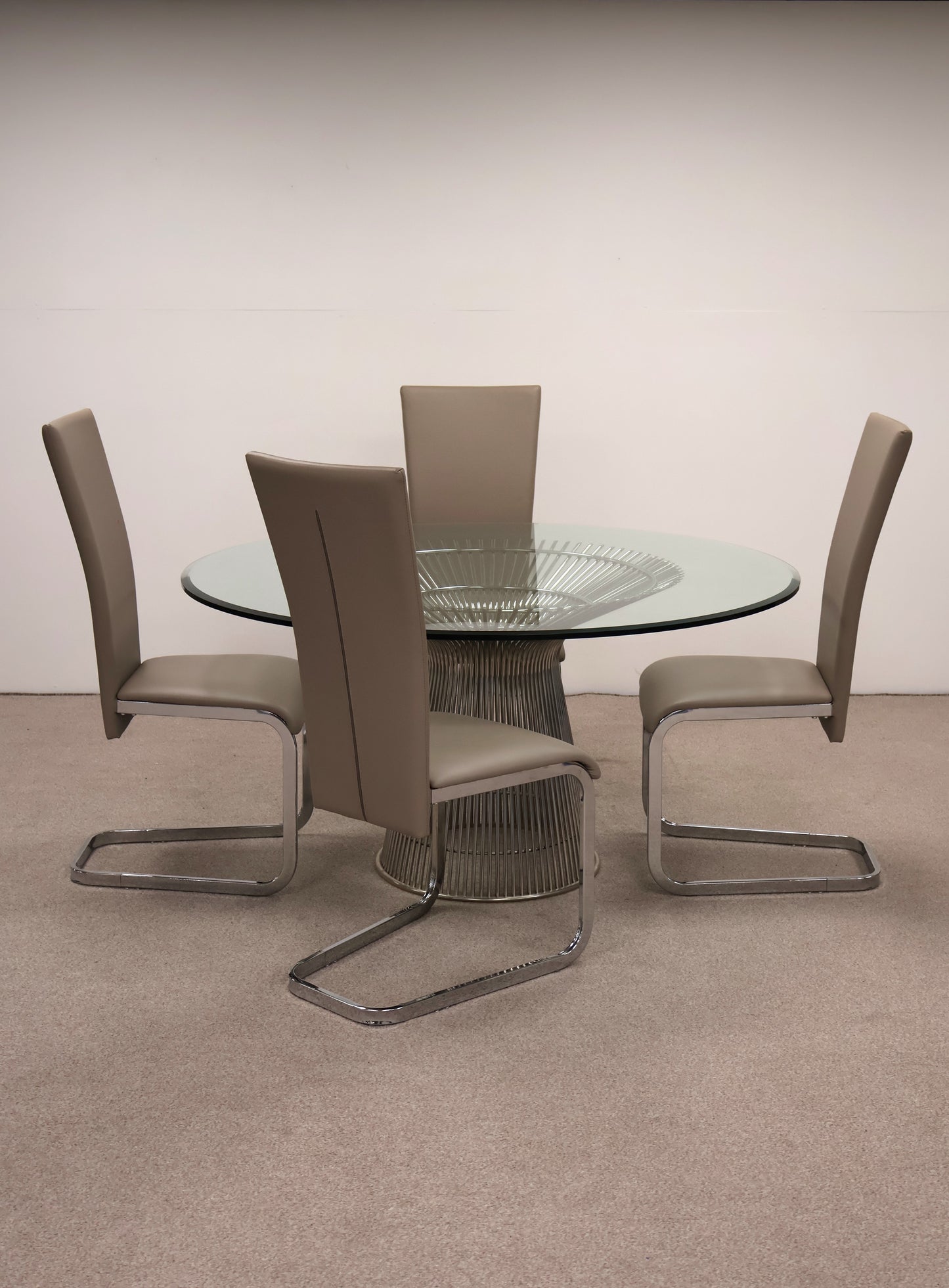 Circular Glass Table with Ornate Chrome base and Chairs