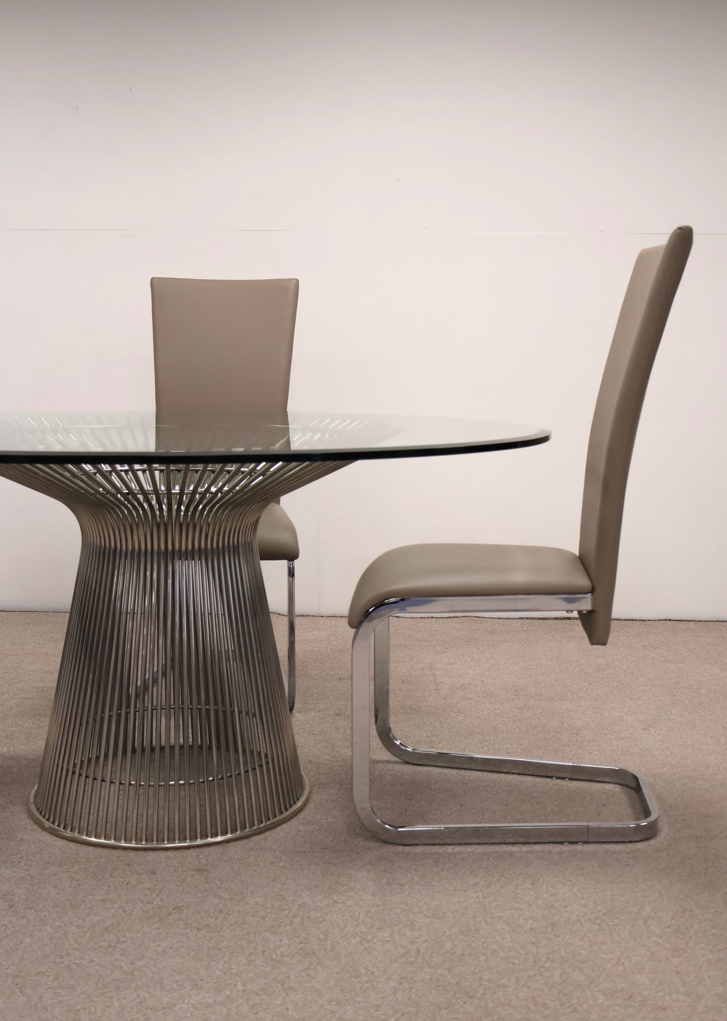 Circular Glass Table with Ornate Chrome base and Chairs